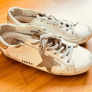 Golden Goose sneaker with silver accent.  Size 38 / 8